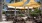 a group of tables sit under an umbrella