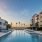 Dusk Shot of Heated saltwater pool with cabana seating