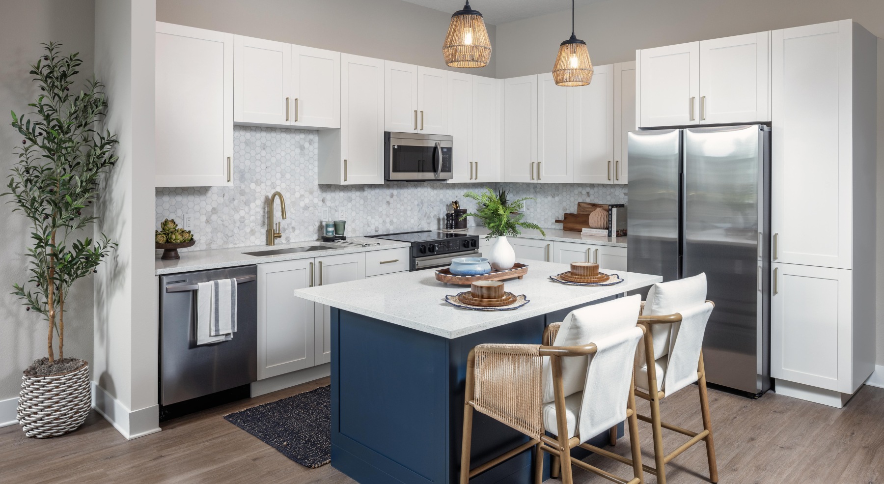 Kitchens with large islands and stainless steel appliances