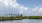 a body of water with trees and a boat in it